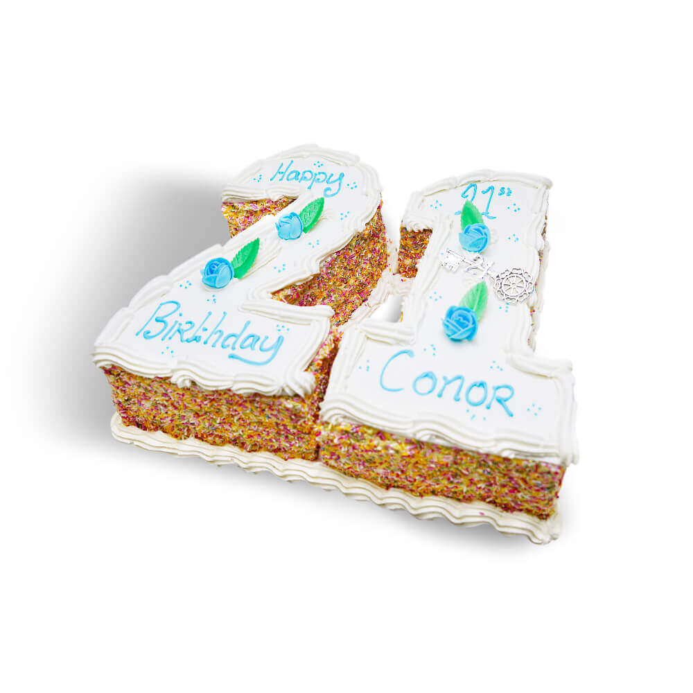 A white birthday cake with blue writing in the shape of the number 21