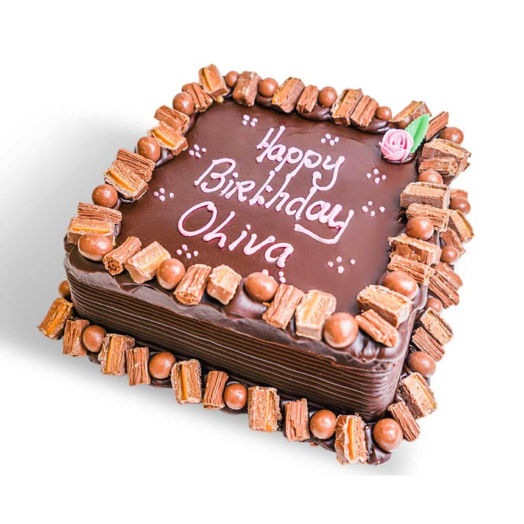 A chocolate birthday cake with chocolate wafer decorations